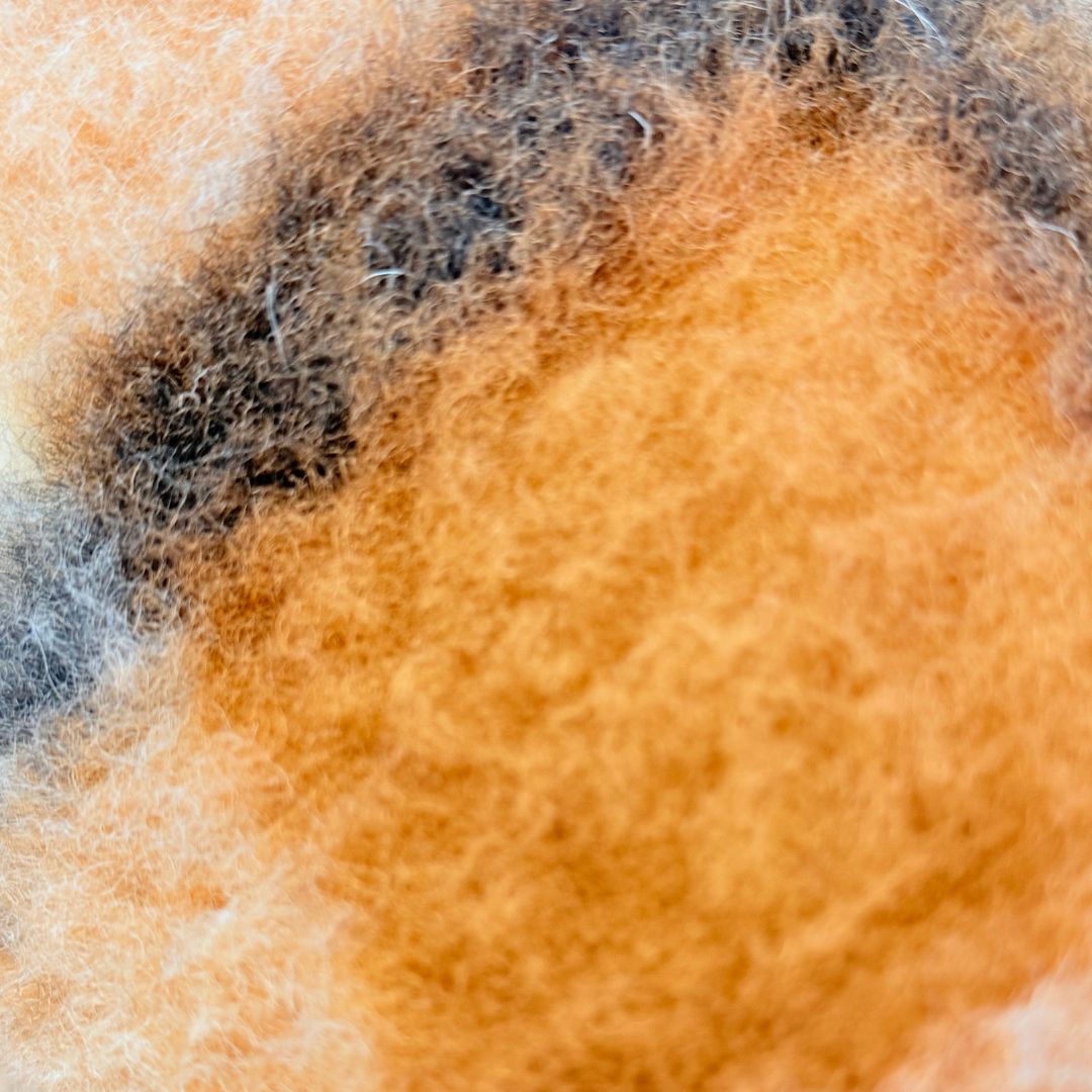 Double-sided grey checkered lambswool cylinder pillow