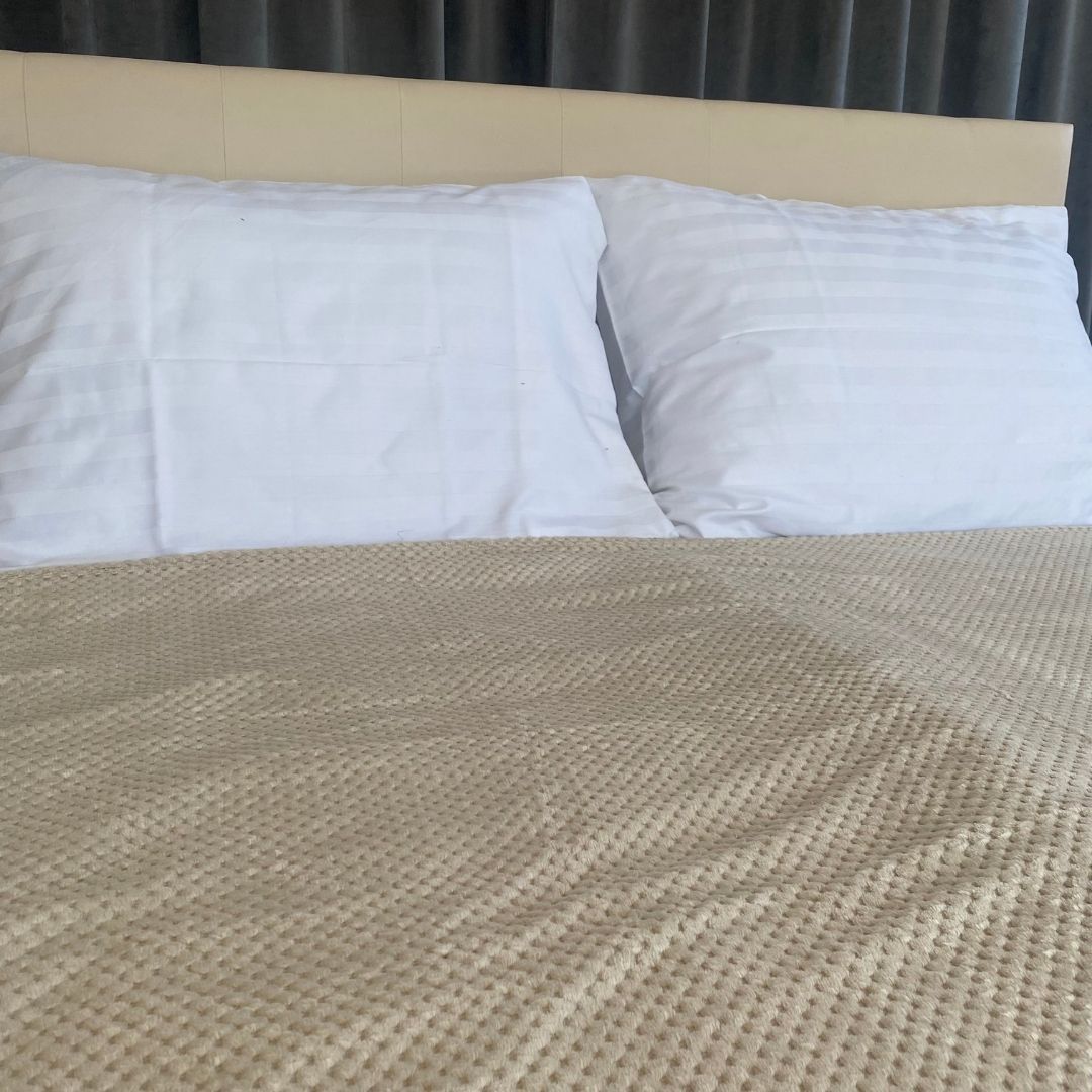 Beige polka dot bedspread